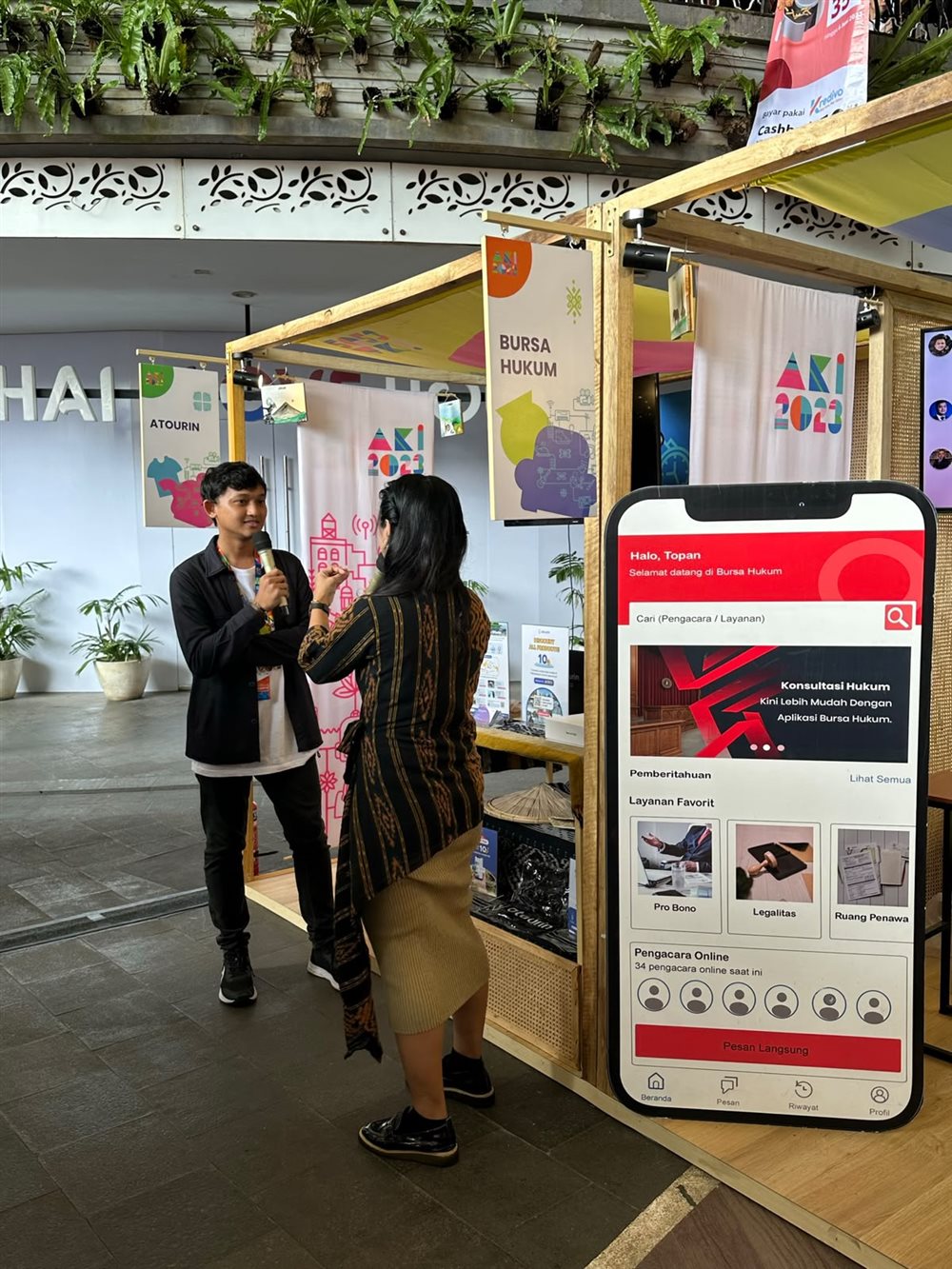 Bursa Hukum booth with a client-app display at the Ministry of Industry startup showcase